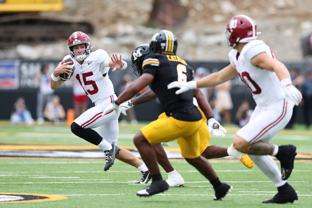 Oct 11, 2025; Columbia, Missouri, USA;  Alabama Crimson Tide quarterback Ty Simpson (15) runs the ball against Missouri Tigers safety Jalen Catalon (6) during the first half at Faurot Field at Memorial Stadium. 