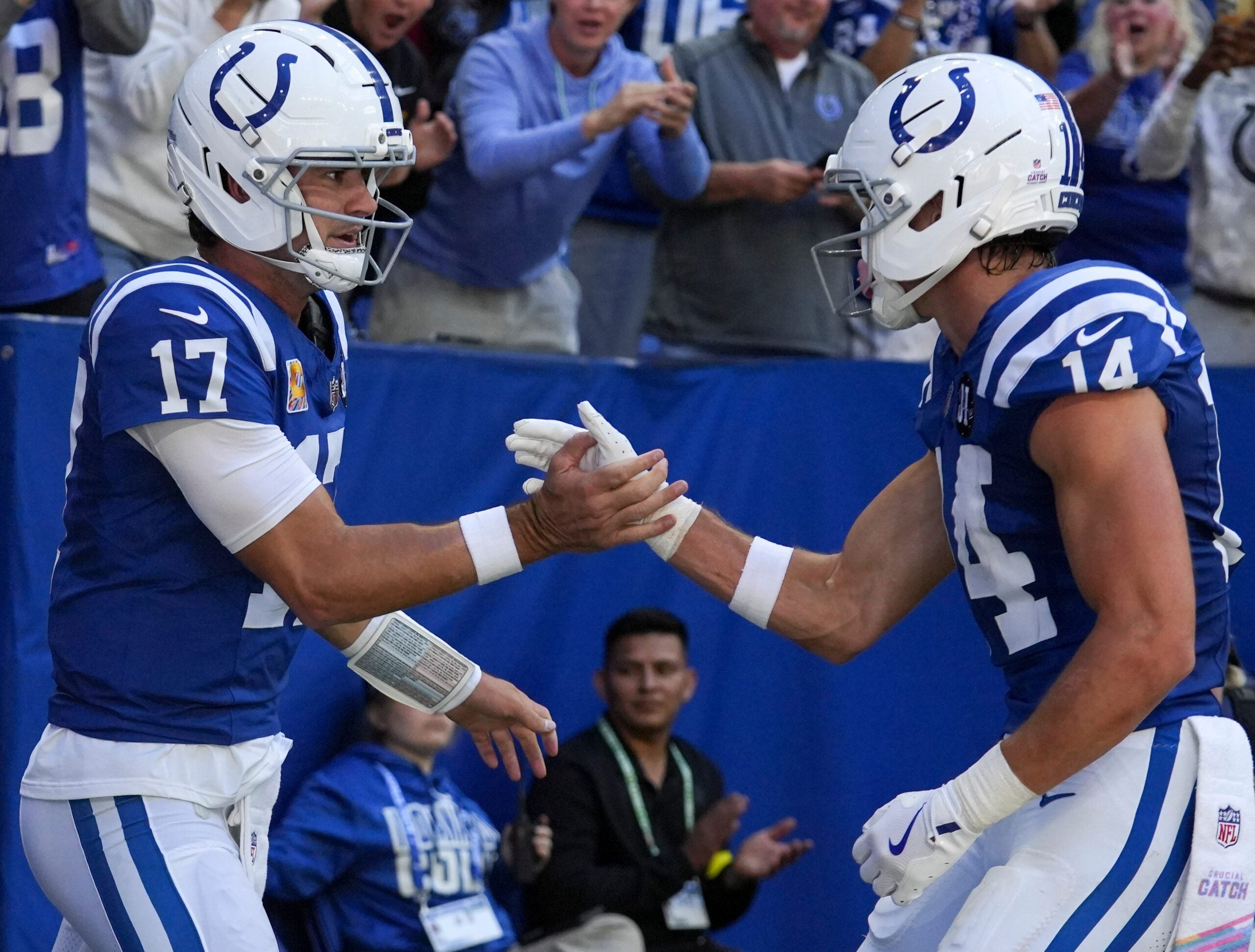 Oct 12, 2025; Indianapolis, Indiana, USA; Indianapolis Colts quarterback Daniel Jones (17) celebrates with wide receiver Alec Pierce (14) after Jones scores a touchdown during a game against the Arizona Cardinals at Lucas Oil Stadium.