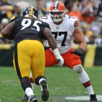 Oct 12, 2025; Pittsburgh, Pennsylvania, USA; Cleveland Browns guard Wyatt Teller (77) blocks at the line of scrimmage against Pittsburgh Steelers defensive tackle Keeanu Benton (95) during the second quarter at Acrisure Stadium.