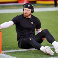 Oct 19, 2025; Kansas City, Missouri, USA; Las Vegas Raiders defensive end Maxx Crosby (98) stretches during warmups prior to the game against the Kansas City Chiefs at GEHA Field at Arrowhead Stadium.