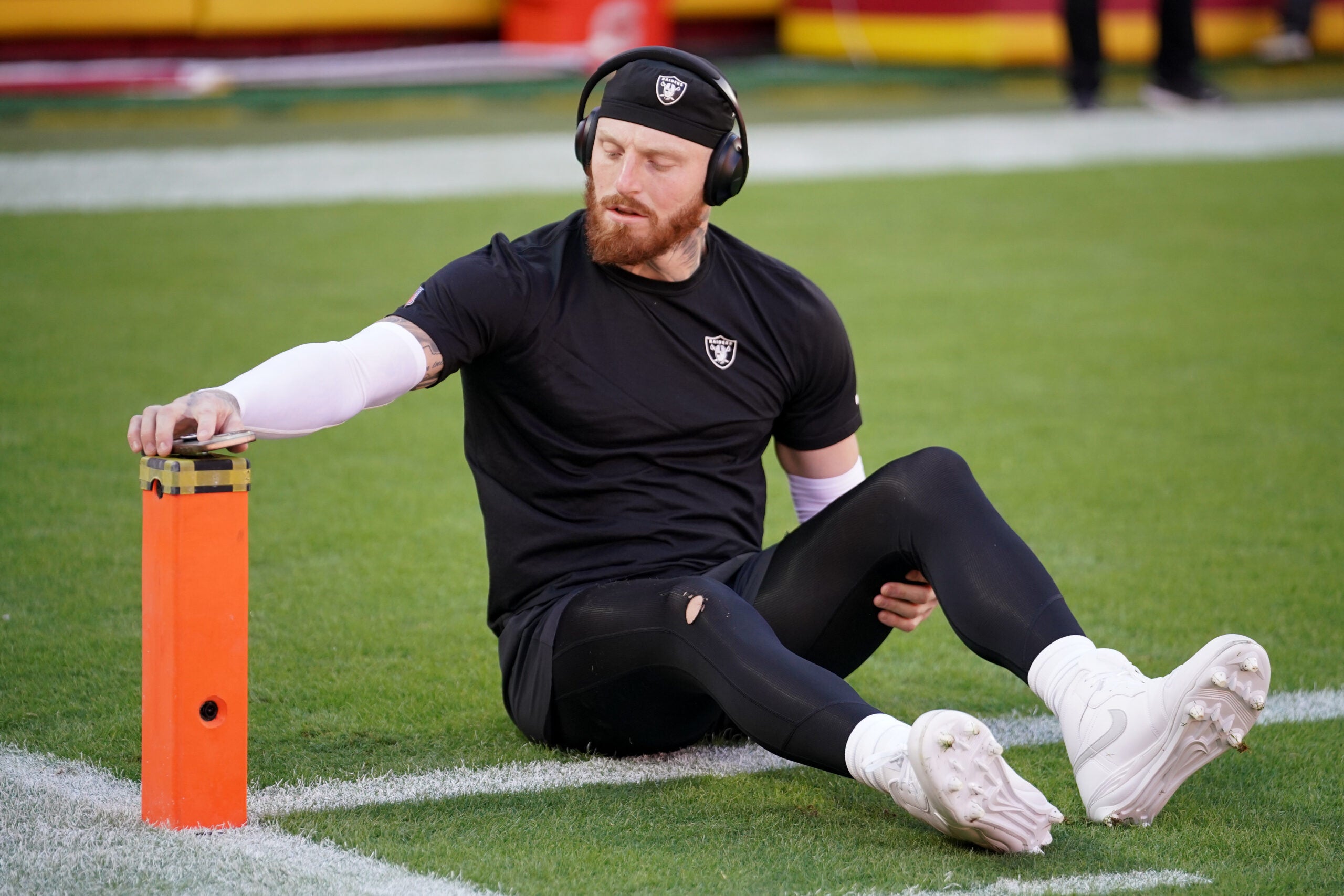Oct 19, 2025; Kansas City, Missouri, USA; Las Vegas Raiders defensive end Maxx Crosby (98) stretches during warmups prior to the game against the Kansas City Chiefs at GEHA Field at Arrowhead Stadium.