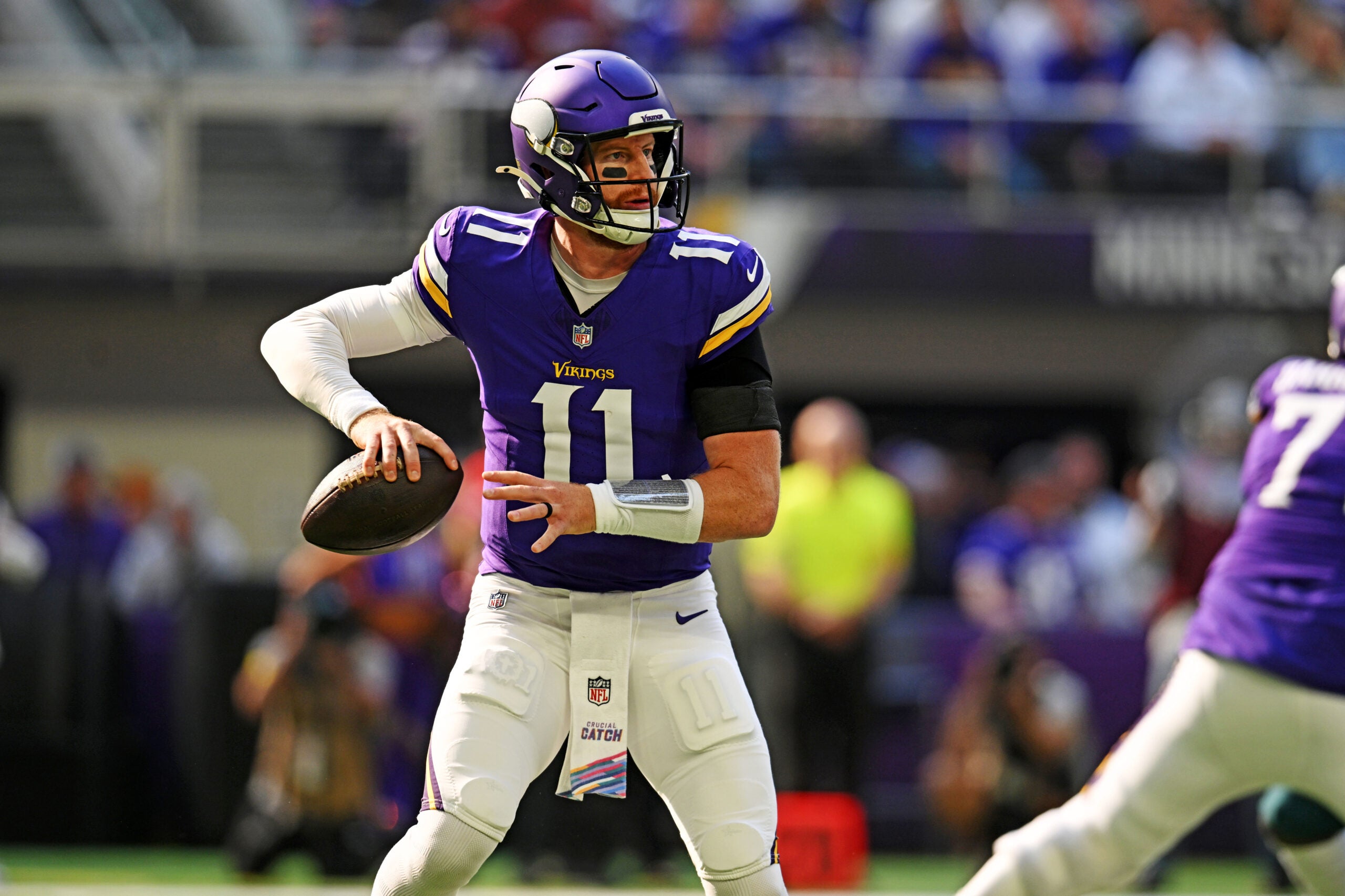 Oct 19, 2025; Minneapolis, Minnesota, USA; Minnesota Vikings quarterback Carson Wentz (11) makes a pass during the first half against the Philadelphia Eagles at U.S. Bank Stadium.