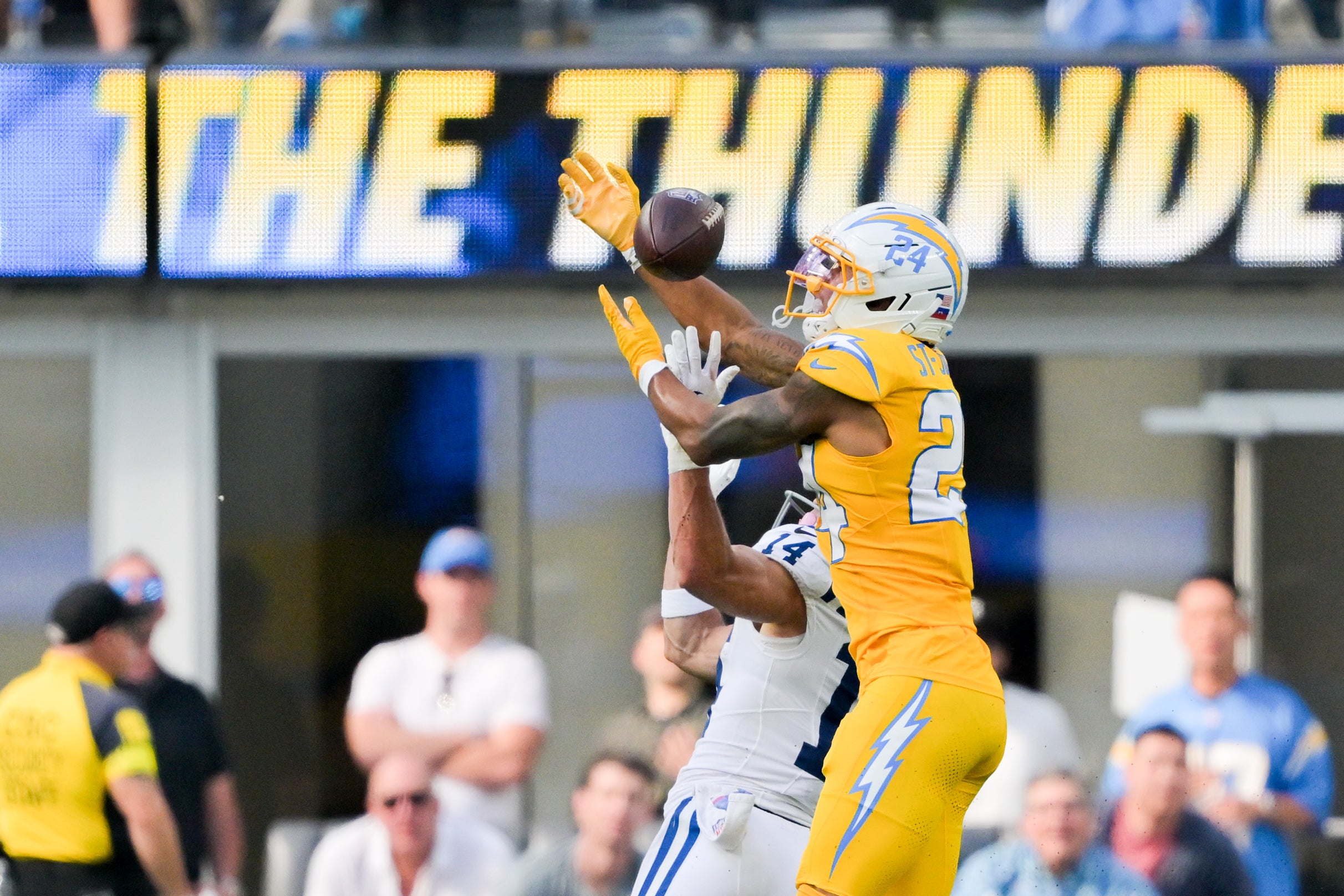 Oct 19, 2025; Inglewood, California, USA; Los Angeles Chargers cornerback Benjamin St-Juste (24) breaks up a pass intended for Indianapolis Colts wide receiver Alec Pierce (14) in the first half at SoFi Stadium.