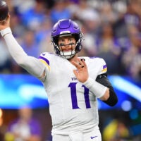 Oct 23, 2025; Inglewood, California, USA; Minnesota Vikings quarterback Carson Wentz (11) drops back to pass against the Los Angeles Chargers during the first half at SoFi Stadium.