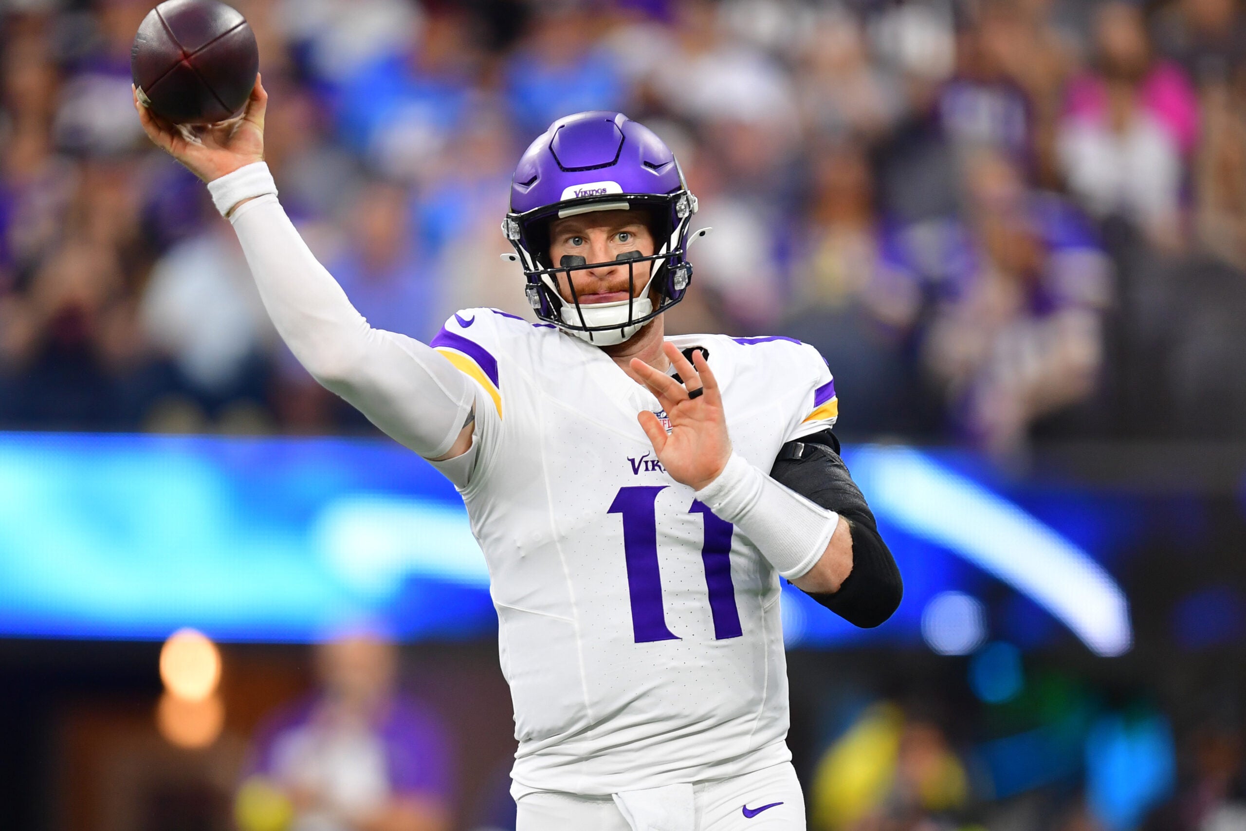 Oct 23, 2025; Inglewood, California, USA; Minnesota Vikings quarterback Carson Wentz (11) drops back to pass against the Los Angeles Chargers during the first half at SoFi Stadium.