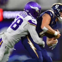 Oct 23, 2025; Inglewood, California, USA; Minnesota Vikings linebacker Jonathan Greenard (58) gets pressure on Los Angeles Chargers quarterback Justin Herbert (10) during the first half at SoFi Stadium.