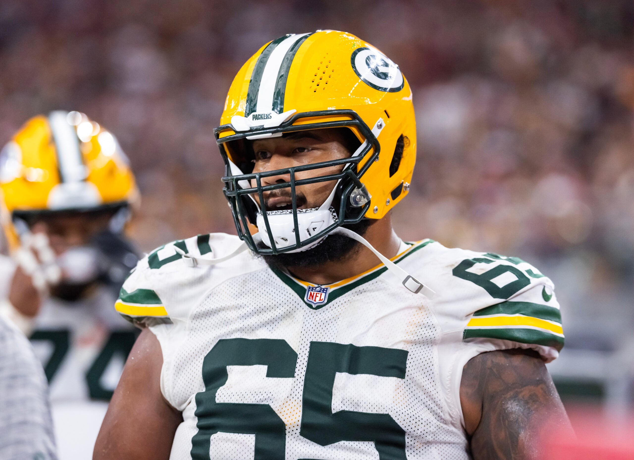Oct 19, 2025; Glendale, Arizona, USA; Green Bay Packers guard Aaron Banks (65) against the Arizona Cardinals at State Farm Stadium.