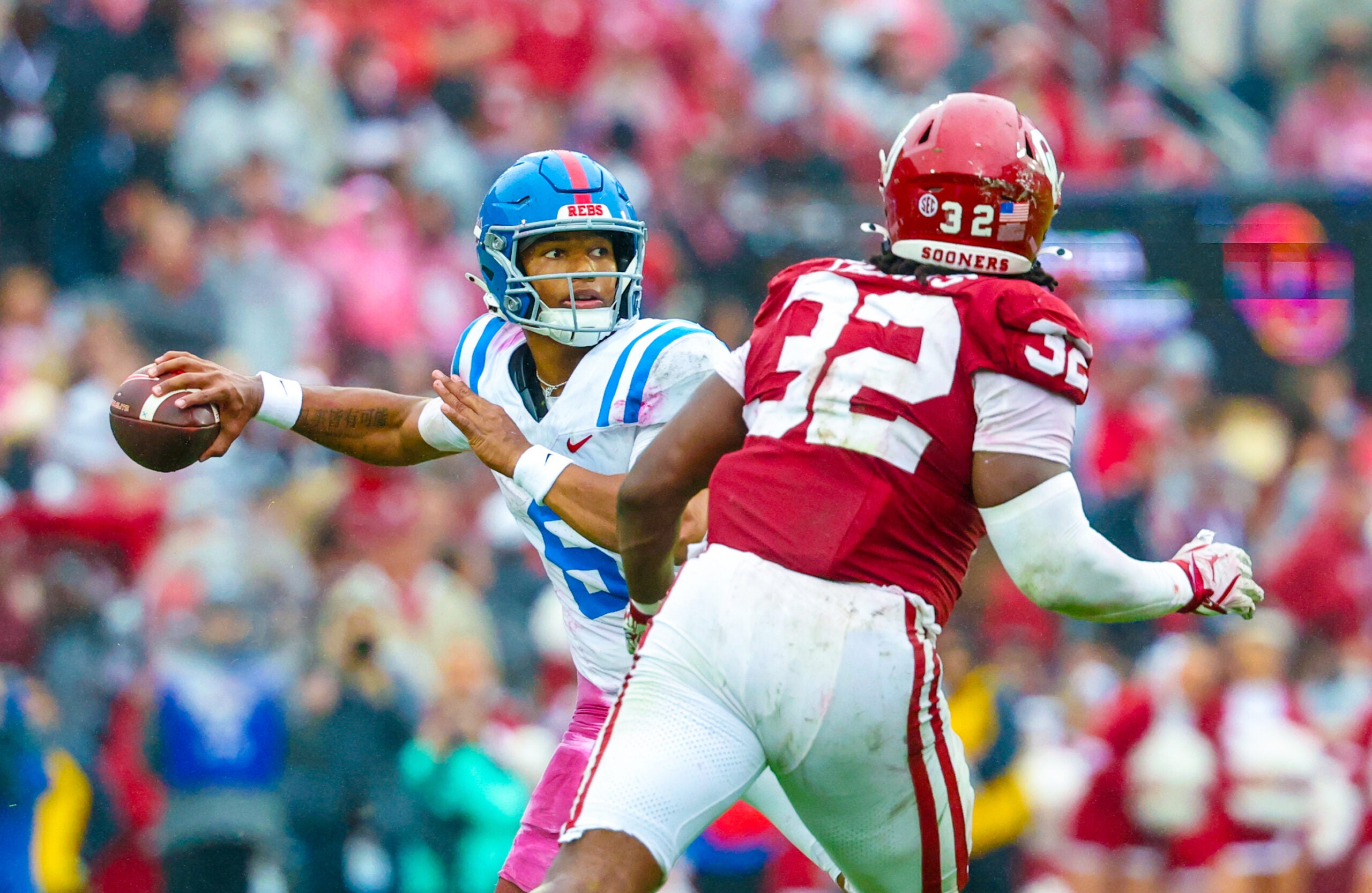Oct 25, 2025; Norman, Oklahoma, USA; Ole Miss Rebels quarterback Trinidad Chambliss (6) throws as Oklahoma Sooners defensive lineman R Mason Thomas (32) defends during the first half at Gaylord Family-Oklahoma Memorial Stadium. Mandatory Credit: Kevin Jairaj-Imagn Images