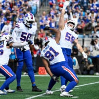 Oct 26, 2025; Charlotte, North Carolina, USA; Buffalo Bills linebacker Shaq Thompson (45), defensive end Greg Rousseau (50), defensive tackle Ed Oliver (91) and defensive end Michael Hoecht (55) celebrate after a sack during the first half against the Carolina Panthers at Bank of America Stadium.