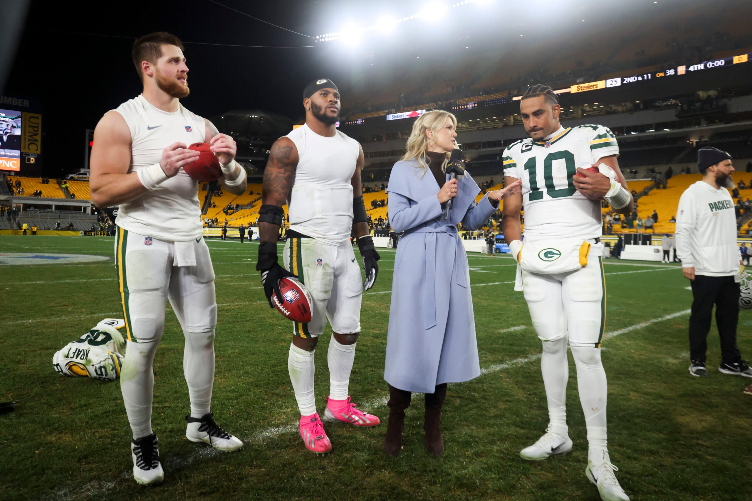Oct 26, 2025; Pittsburgh, Pennsylvania, USA; Sports commentator Melissa Stark interviews (from left to right) Green Bay Packers tight end Tucker Kraft (85), defensive end Micah Parsons (1) and quarterback Jordan Love (10) after the game against the Pittsburgh Steelers at Acrisure Stadium.