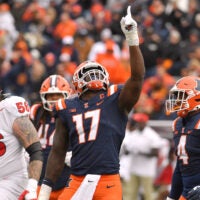 Nov 1, 2025; Champaign, Illinois, USA; Illinois Fighting Illini linebacker Gabe Jacas (17) celebrates his sack on Rutgers Scarlet Knights quarterback Athan Kaliakmanis (16) during the first half at Memorial Stadium. Mandatory Credit: Ron Johnson-Imagn Images