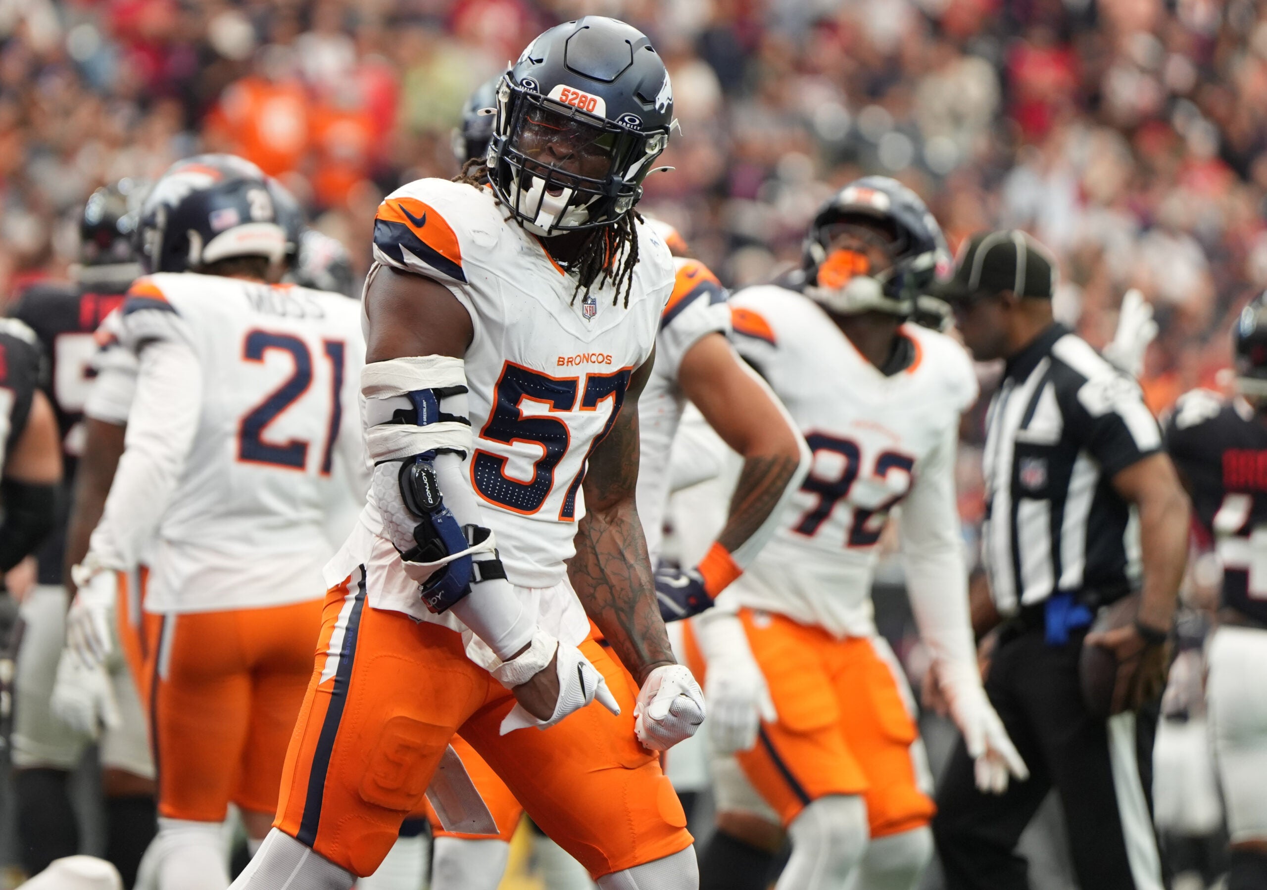 Nov 2, 2025; Houston, Texas, USA; Denver Broncos linebacker Dre Greenlaw (57) reacts after a play during the first half against the Houston Texans at NRG Stadium.