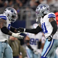 Nov 3, 2025; Arlington, Texas, USA; Dallas Cowboys defensive tackle Kenny Clark (95) celebrates with defensive end Donovan Ezeiruaku (41) after a sack against Arizona Cardinals quarterback Jacoby Brissett (7) in the second half at AT&T Stadium.