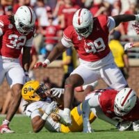 Oklahoma defensive linemen R Mason Thomas (32), Markus Strong (99) and David Stone, lower right, react to stopping Kent State running back Jahzae Kimbrough (84) during the first half of an NCAA football game between the Oklahoma Sooners (OU) and Kent State Golden Flashes at Gaylord Family - Oklahoma Memorial Stadium in Norman, Okla., Saturday, Oct. 4, 2025.