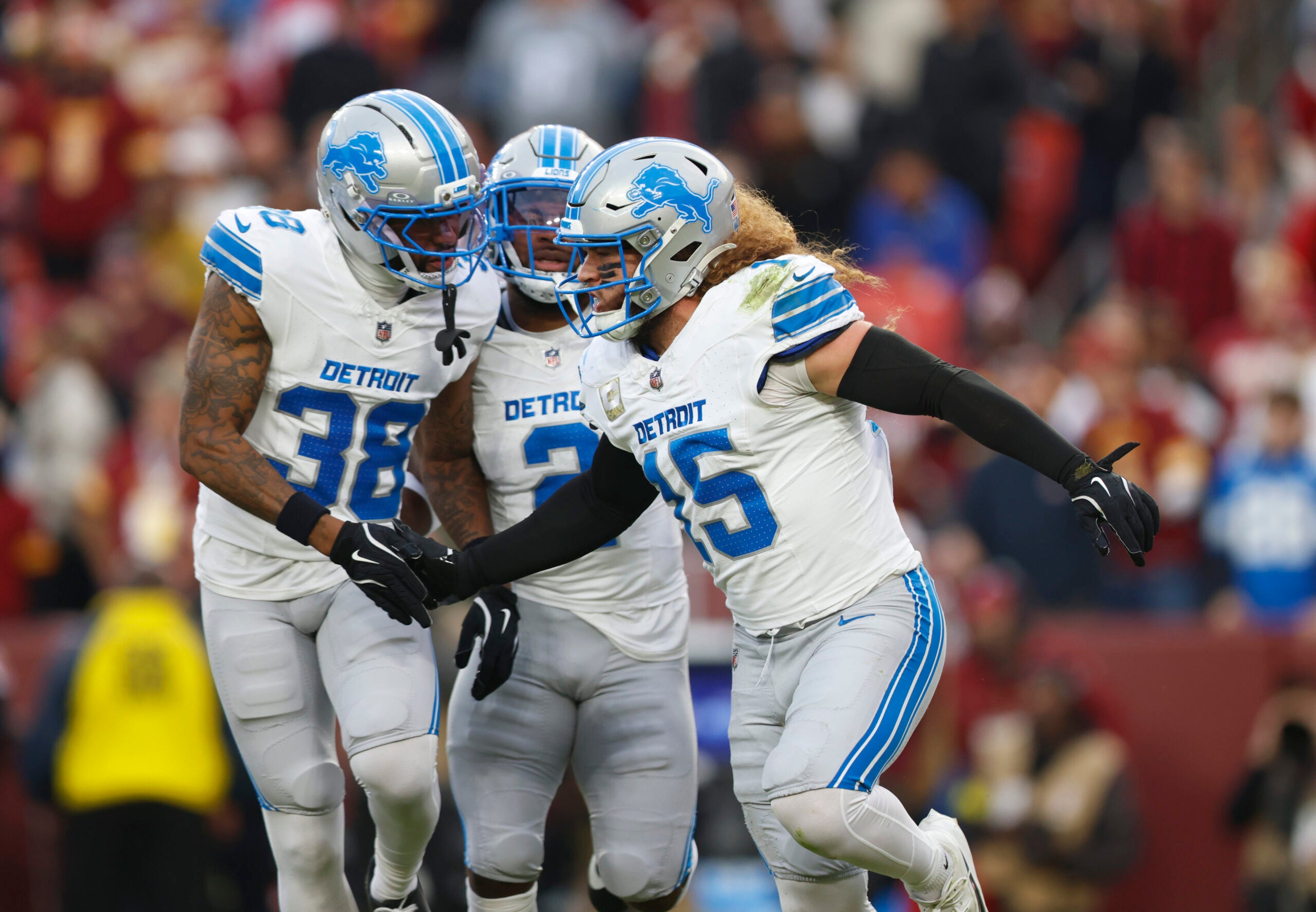 Nov 9, 2025; Landover, Maryland, USA; Detroit Lions linebacker Grant Stuard (15) celebrates with teammates after a stop on the kickoff during the first quarter against the Washington Commanders at Northwest Stadium. \
