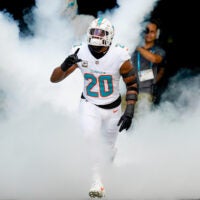 Nov 9, 2025; Miami Gardens, Florida, USA; Miami Dolphins linebacker Jordyn Brooks (20) runs on the field before a game against the Buffalo Bills at Hard Rock Stadium.