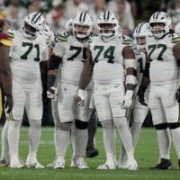 The Green Bay Packers offensive line is shown during the first quarter of their game against the Washington Commanders Thursday, September 11, 2025 at Lambeau Field in Green Bay, Wisconsin. Shown are offensive tackle Anthony Belton (71), guard Sean Rhyan (75), guard Elgton Jenkins (74), offensive tackle Jordan Morgan (77) and offensive tackle Rasheed Walker (63).