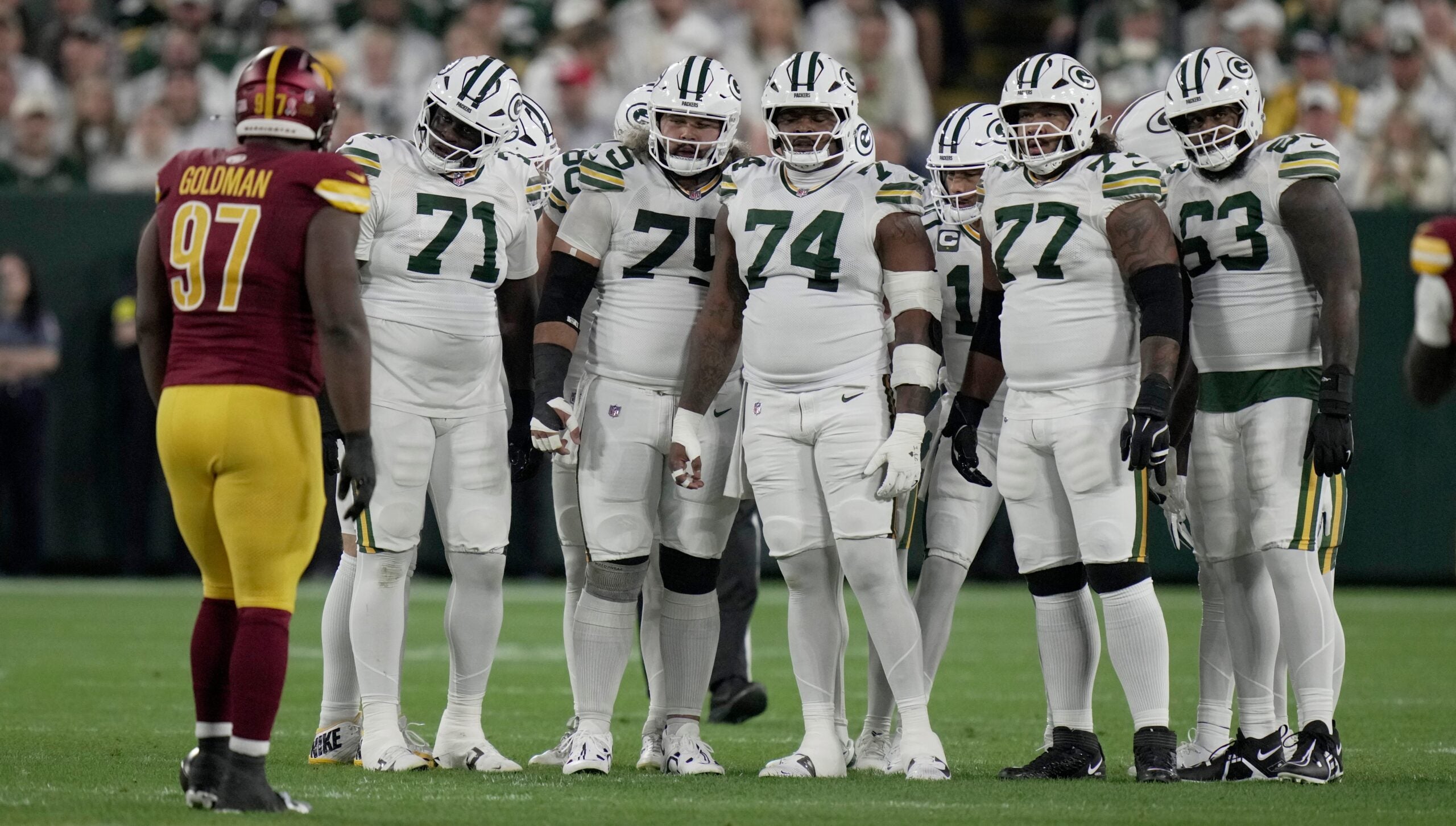 The Green Bay Packers offensive line is shown during the first quarter of their game against the Washington Commanders Thursday, September 11, 2025 at Lambeau Field in Green Bay, Wisconsin. Shown are offensive tackle Anthony Belton (71), guard Sean Rhyan (75), guard Elgton Jenkins (74), offensive tackle Jordan Morgan (77) and offensive tackle Rasheed Walker (63).