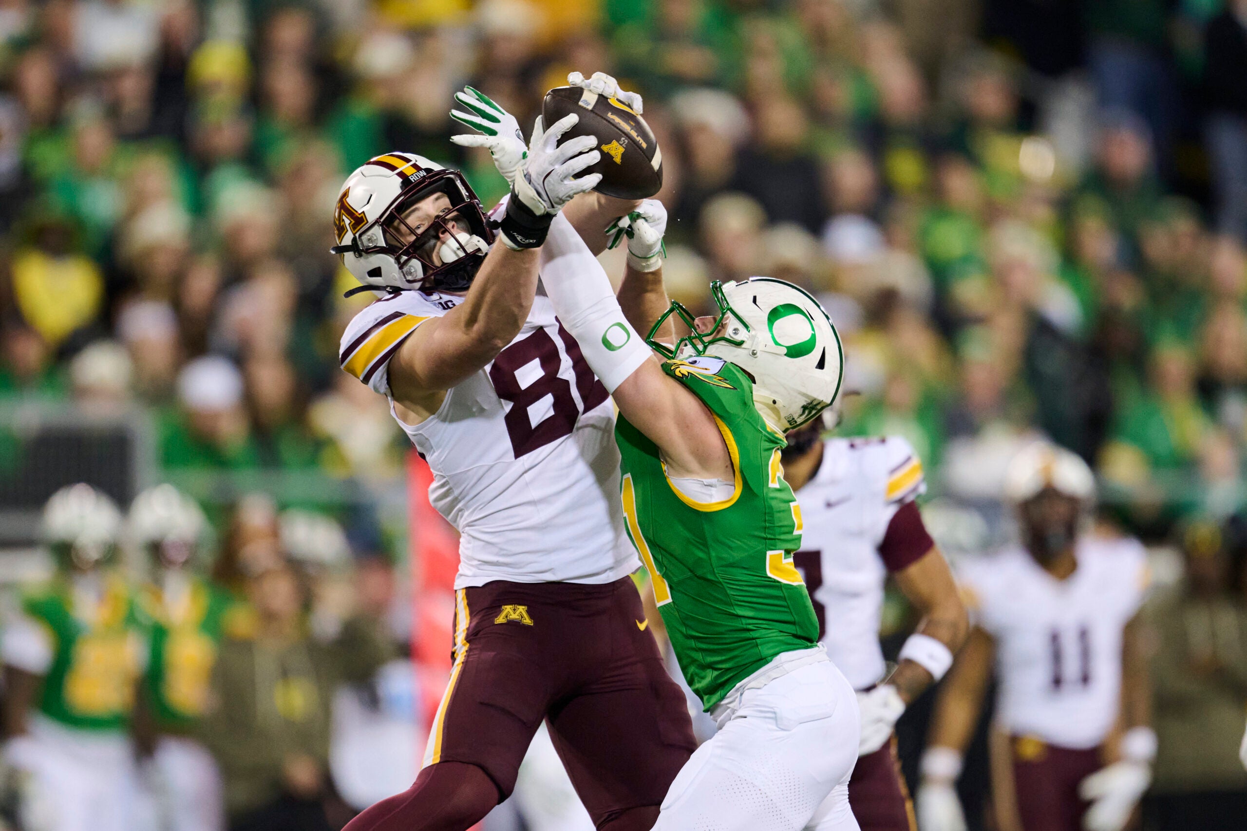 Nov 14, 2025; Eugene, Oregon, USA; Oregon Ducks defensive back Dillon Thieneman (31) breaks up a pass play intended for Minnesota Golden Gophers tight end Jameson Geers (86) during the first half at Autzen Stadium.