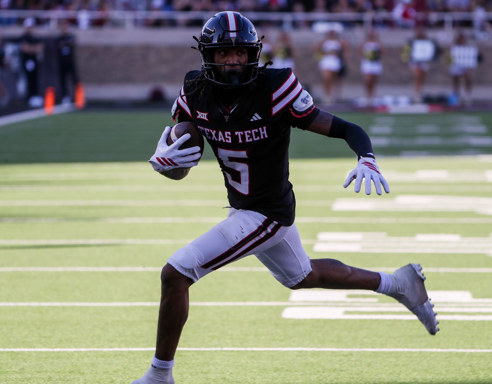 Texas Tech's Caleb Douglas runs after a catch against UCF during a Big 12 Conference football game, Saturday, Nov. 15, 2025, at Jones AT&T Stadium.
