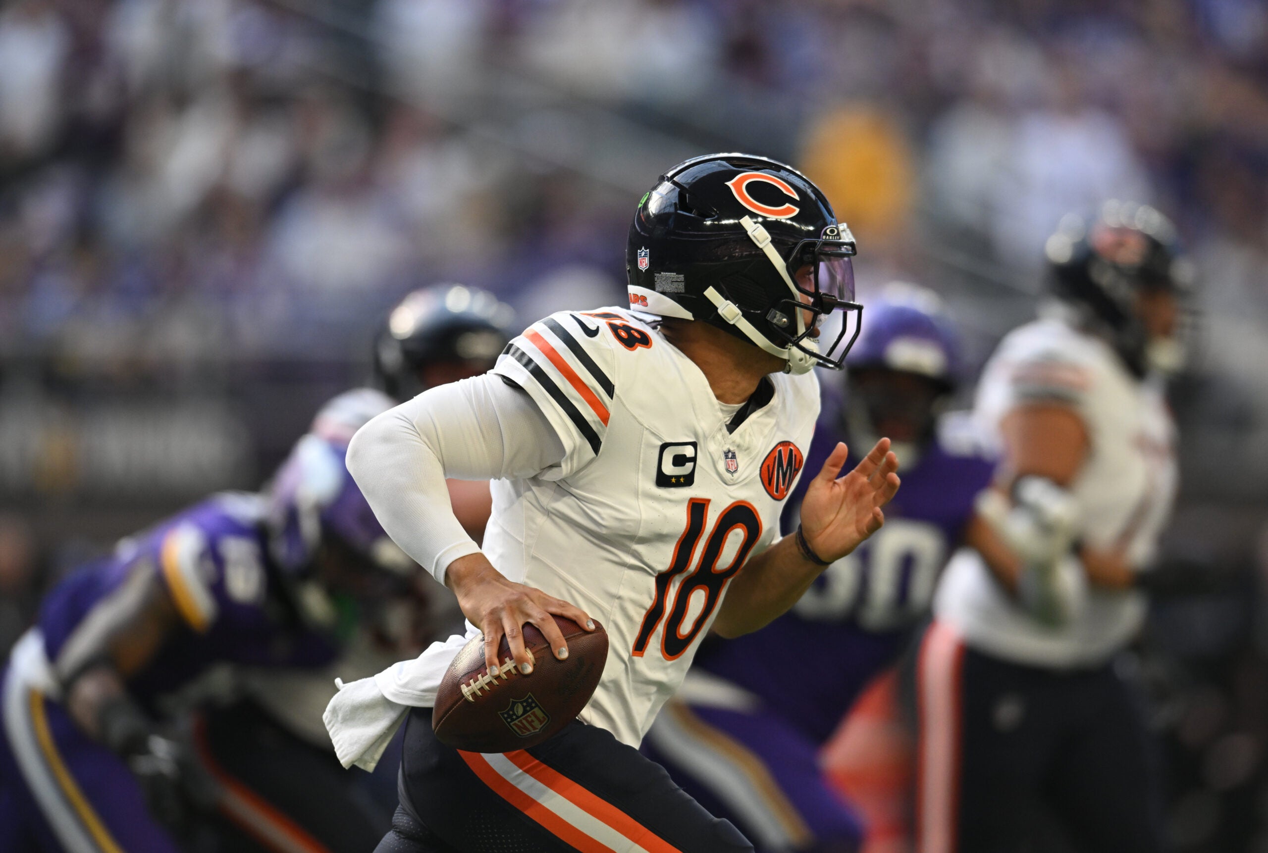 Nov 16, 2025; Minneapolis, Minnesota, USA; Chicago Bears quarterback Caleb Williams (18) runs in the pocket during the second quarter against the Minnesota Vikings at U.S. Bank Stadium.