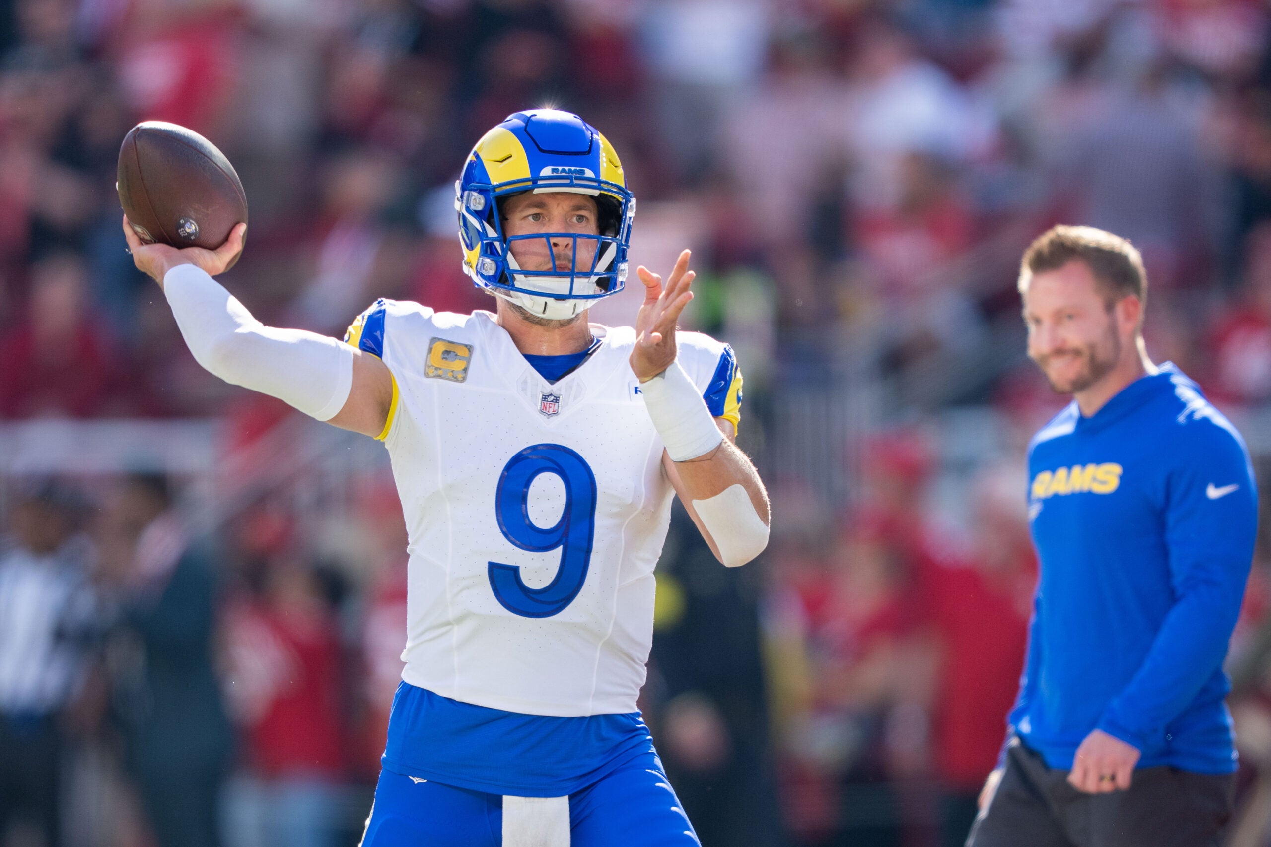 November 9, 2025; Santa Clara, California, USA; Los Angeles Rams quarterback Matthew Stafford (9) warms up in front of head coach Sean McVay (right) before the game against the San Francisco 49ers at Levi's Stadium.