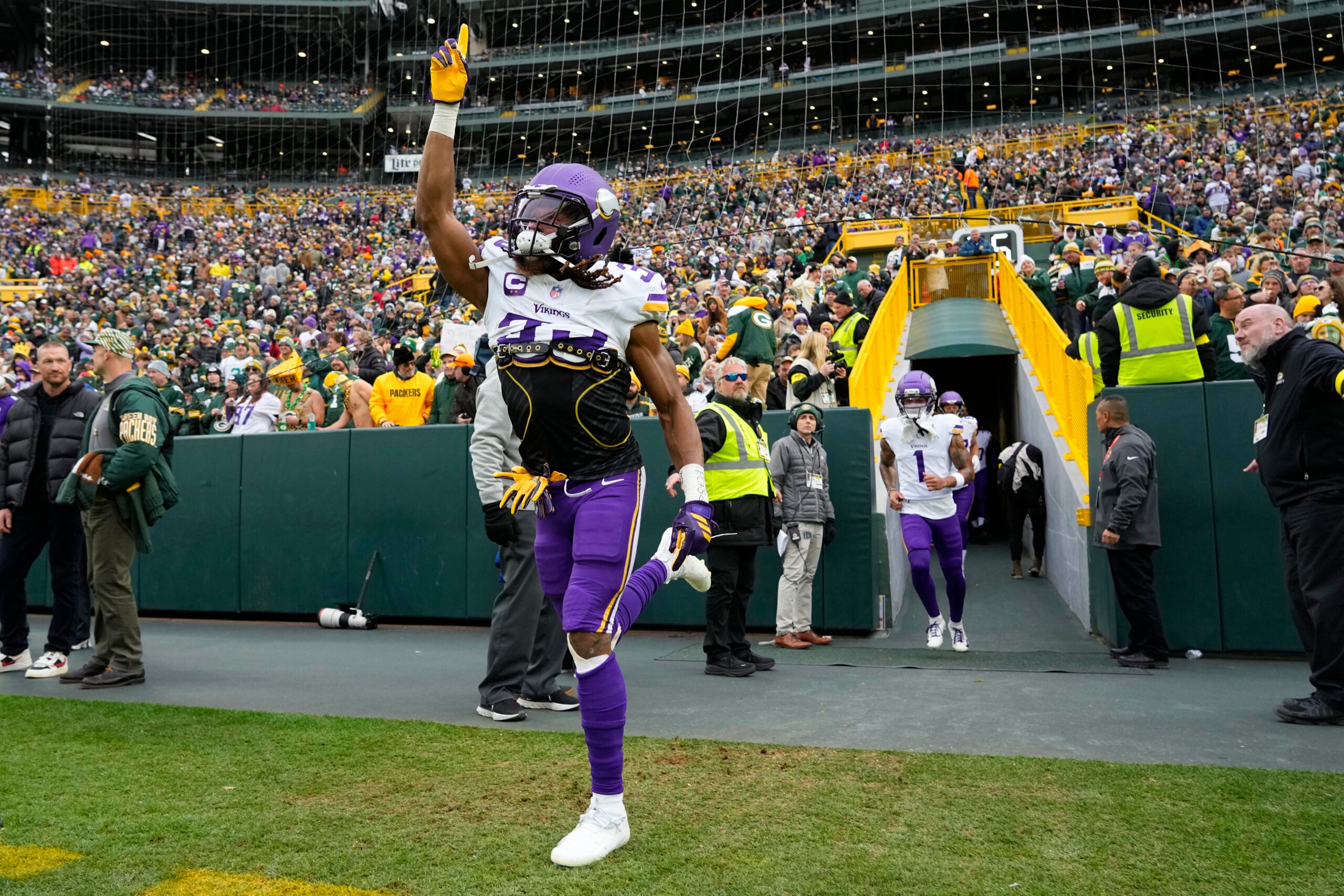Nov 23, 2025; Green Bay, Wisconsin, USA; Minnesota Vikings running back Aaron Jones Sr. (33) takes the field prior to a game against the Green Bay Packers at Lambeau Field.