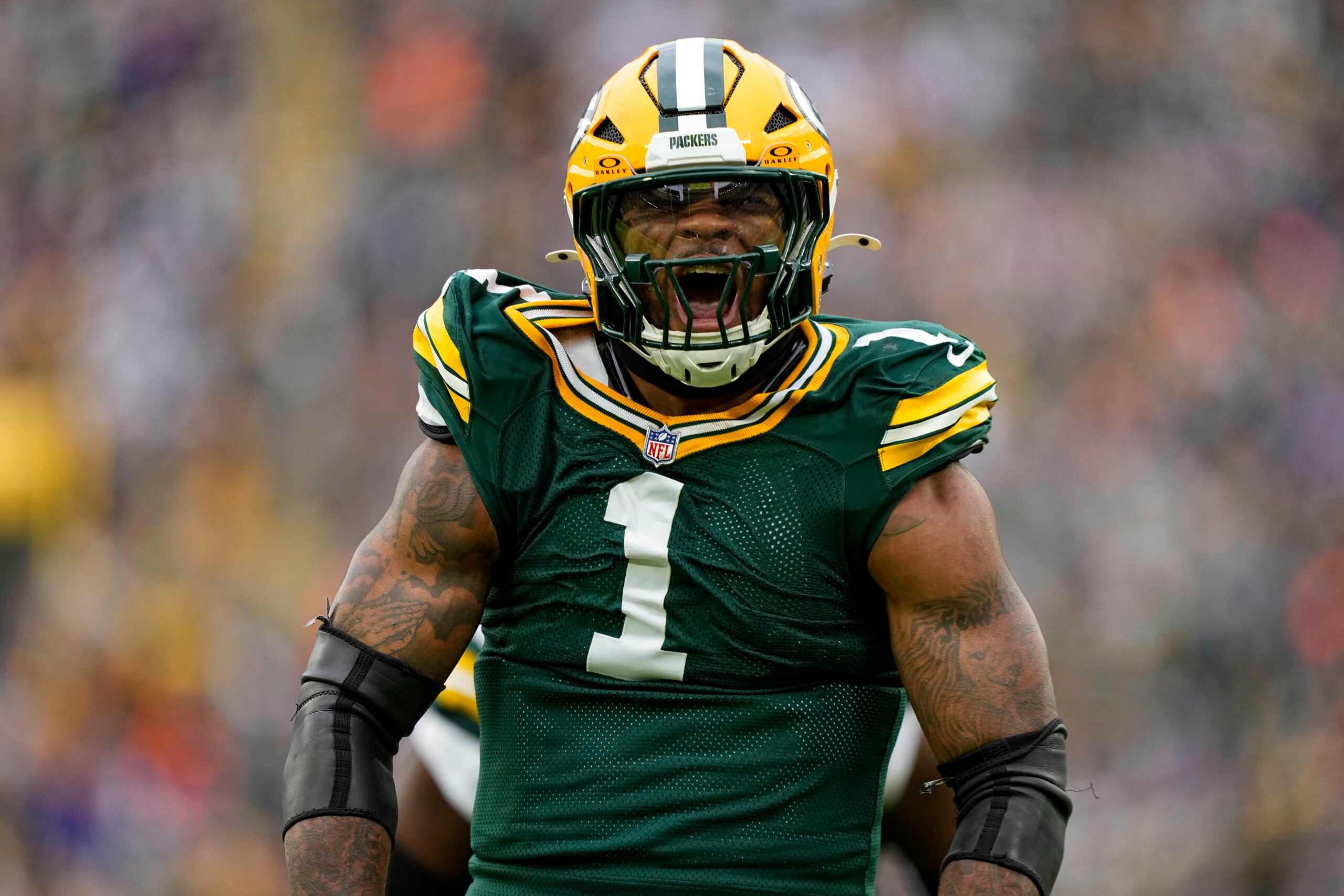 Nov 23, 2025; Green Bay, Wisconsin, USA; Green Bay Packers defensive end Micah Parsons (1) celebrates following a sack during the third quarter against the Minnesota Vikings at Lambeau Field.