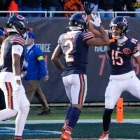 Nov 23, 2025; Chicago, Illinois, USA; Chicago Bears wide receiver DJ Moore (2) reacts with wide receiver Rome Odunze (15) after catching a touchdown against the Pittsburgh Steelers during the second half at Soldier Field.