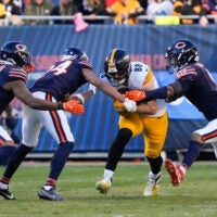 Nov 23, 2025; Chicago, Illinois, USA; Pittsburgh Steelers tight end Pat Freiermuth (88) runs after the catch as Chicago Bears safety Jaquan Brisker (9) and cornerback Nick McCloud (24) defend during the second half at Soldier Field.