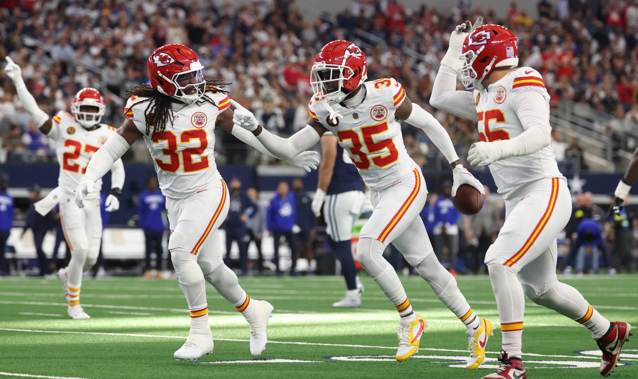 Nov 27, 2025; Arlington, Texas, USA; Kansas City Chiefs linebacker Nick Bolton (32) and Kansas City Chiefs cornerback Jaylen Watson (35) celebrate after an interception against the Dallas Cowboys during the first quarter at AT&T Stadium.