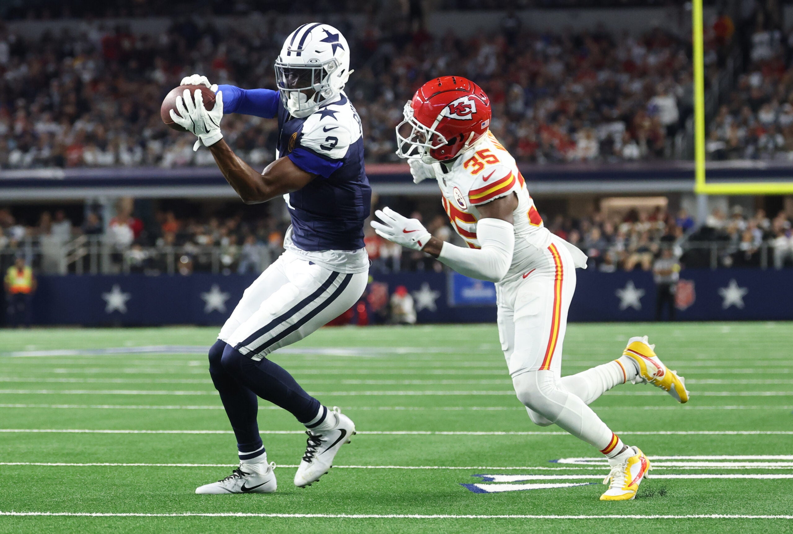 Arlington, Texas, USA; Dallas Cowboys wide receiver George Pickens (3) catches a pass against Kansas City Chiefs cornerback Jaylen Watson (35) during the fourth quarter at AT&T Stadium.