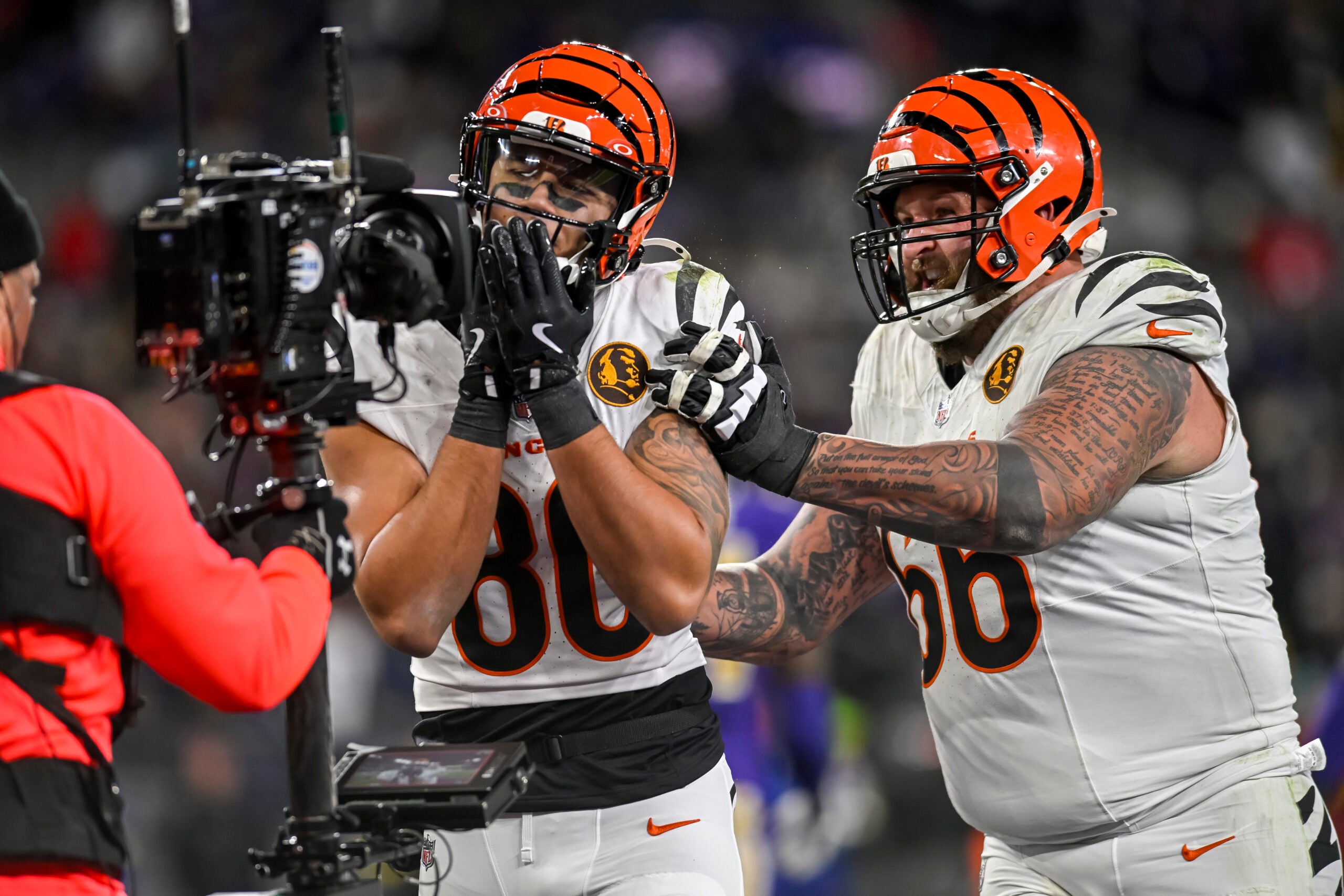 Nov 27, 2025; Baltimore, Maryland, USA; Cincinnati Bengals wide receiver Andrei Iosivas (80) celebrates with guard Dalton Risner (66) after sowing a second half touchdown against the Baltimore Ravens at M&T Bank Stadium.
