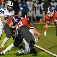 CAL’s Kellan Hall tackles Bell County’s Kaleb Miller in the KHSAA 3A semi final game.