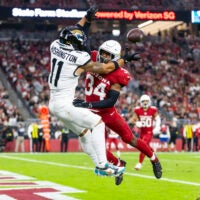 Arizona Cardinals safety Jalen Thompson (34) breaks up a pass to Jacksonville Jaguars wide receiver Parker Washington (11) at State Farm Stadium.