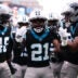 Nov 30, 2025; Charlotte, North Carolina, USA; Carolina Panthers safety Nick Scott (21) celebrates a defensive touchdown scored by Carolina Panthers cornerback Mike Jackson (2) (not pictured) during the first quarter against the Los Angeles Rams at Bank of America Stadium.