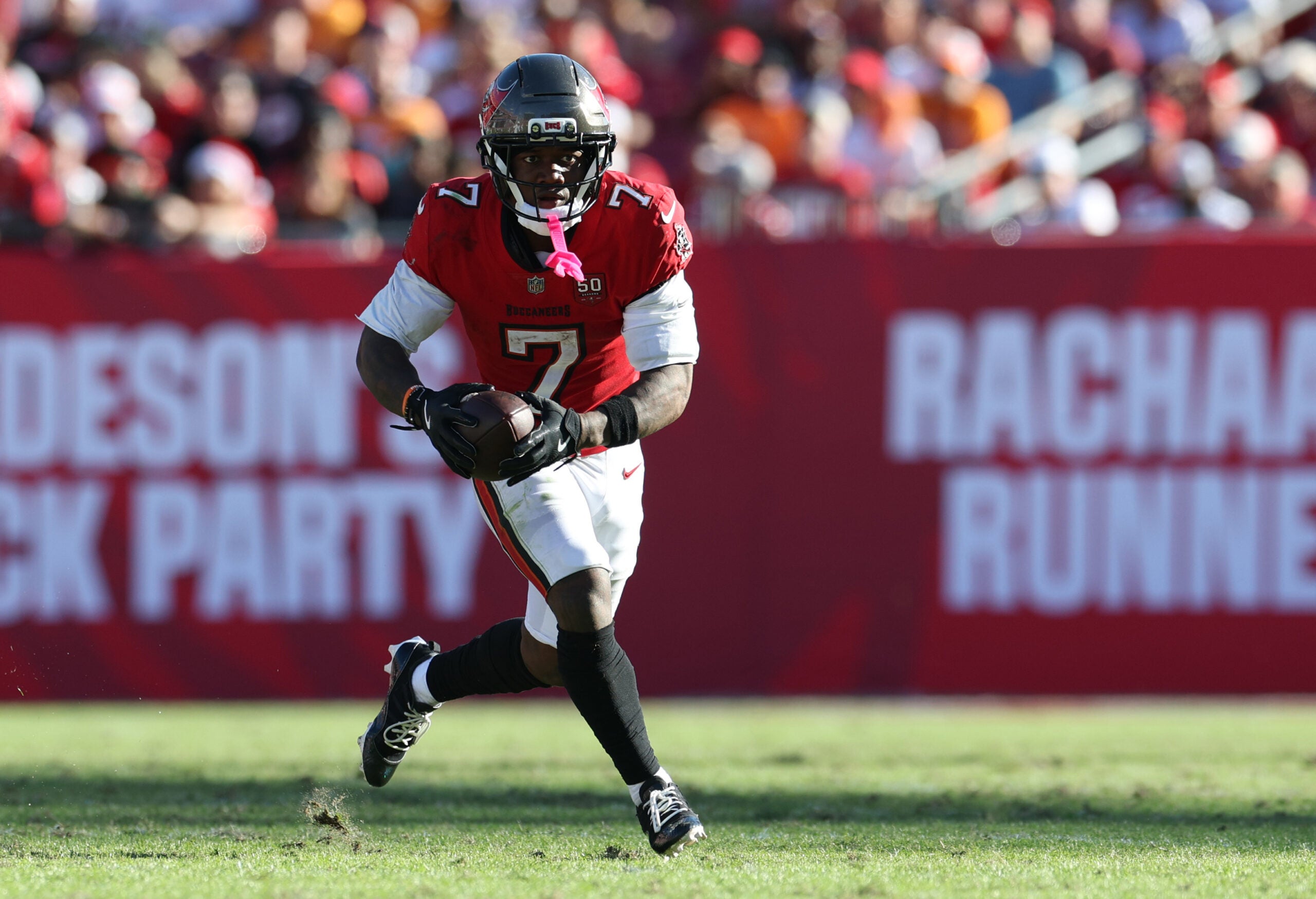 Nov 30, 2025; Tampa, Florida, USA; Tampa Bay Buccaneers running back Bucky Irving (7) runs during the second half against the Arizona Cardinals at Raymond James Stadium.