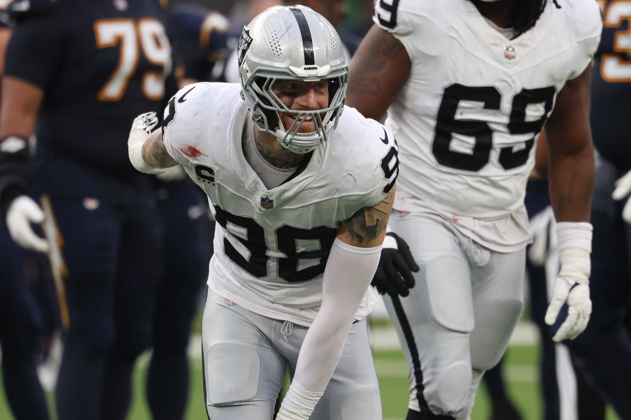 Nov 30, 2025; Inglewood, California, USA; Las Vegas Raiders defensive end Maxx Crosby (98) reacts against the Los Angeles Chargers during the first half at SoFi Stadium.