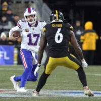 Nov 30, 2025; Pittsburgh, Pennsylvania, USA; Buffalo Bills quarterback Josh Allen (17) scrambles as Pittsburgh Steelers linebacker Patrick Queen (6) defends during the second quarter at Acrisure Stadium.