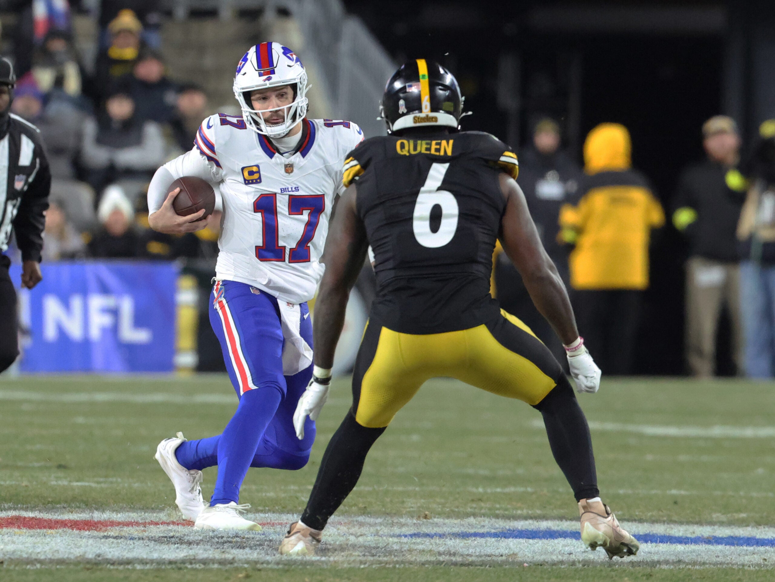 Nov 30, 2025; Pittsburgh, Pennsylvania, USA; Buffalo Bills quarterback Josh Allen (17) scrambles as Pittsburgh Steelers linebacker Patrick Queen (6) defends during the second quarter at Acrisure Stadium.