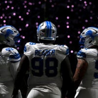 Dec 4, 2025; Detroit, Michigan, USA; Detroit Lions defensive tackle Tyleik Williams (91), defensive tackle DJ Reader (98) and defensive tackle Roy Lopez (51) during a time out in the first half against the Dallas Cowboys at Ford Field.
