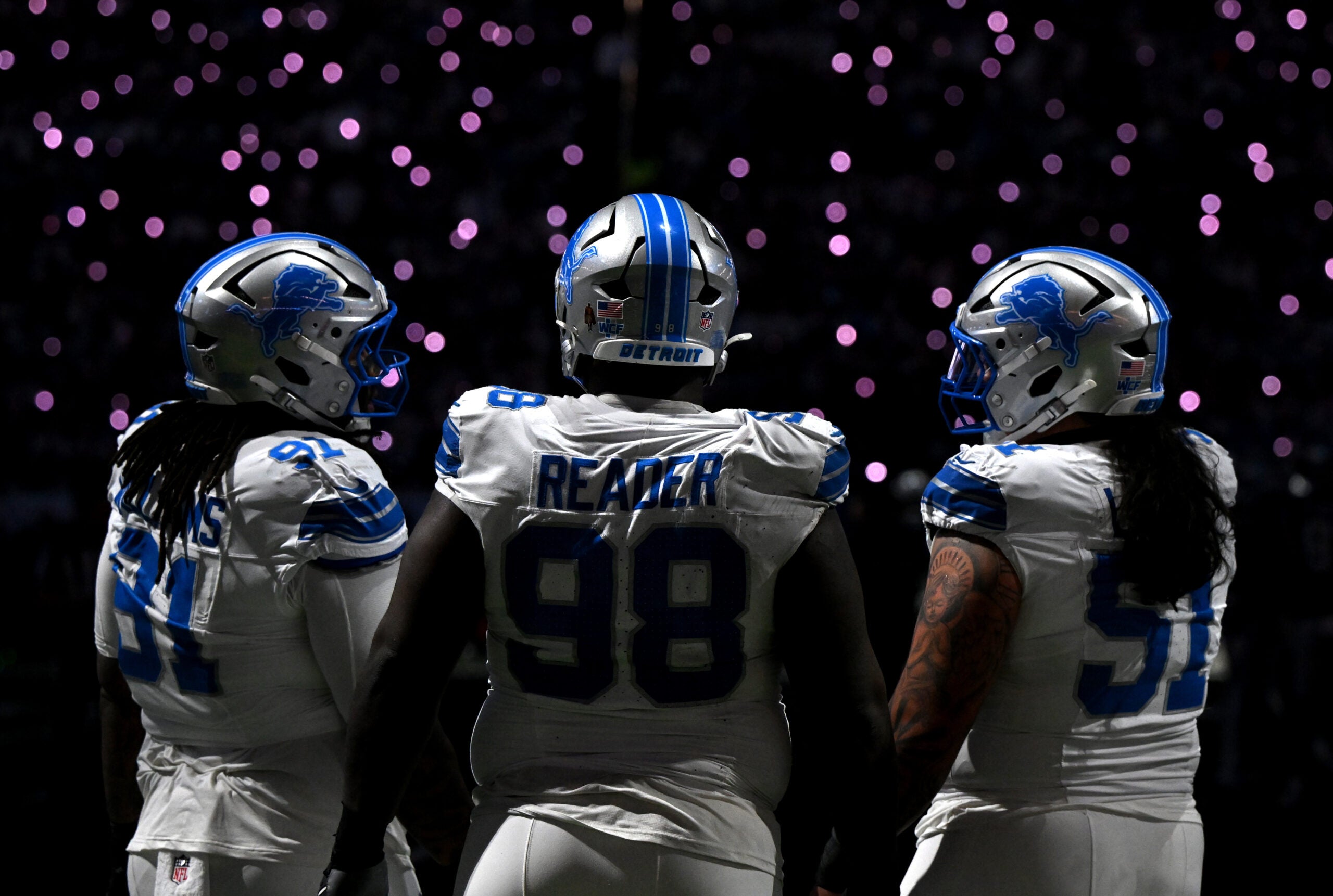 Dec 4, 2025; Detroit, Michigan, USA; Detroit Lions defensive tackle Tyleik Williams (91), defensive tackle DJ Reader (98) and defensive tackle Roy Lopez (51) during a time out in the first half against the Dallas Cowboys at Ford Field.