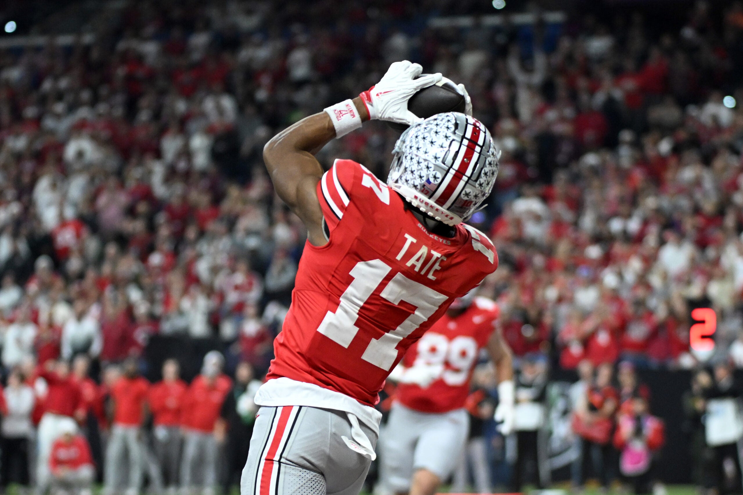 Dec 6, 2025; Indianapolis, IN, USA; Ohio State Buckeyes wide receiver Carnell Tate (17) scores a touchdown against the Indiana Hoosiers in the first quarter during the 2025 Big Ten championship game at Lucas Oil Stadium.