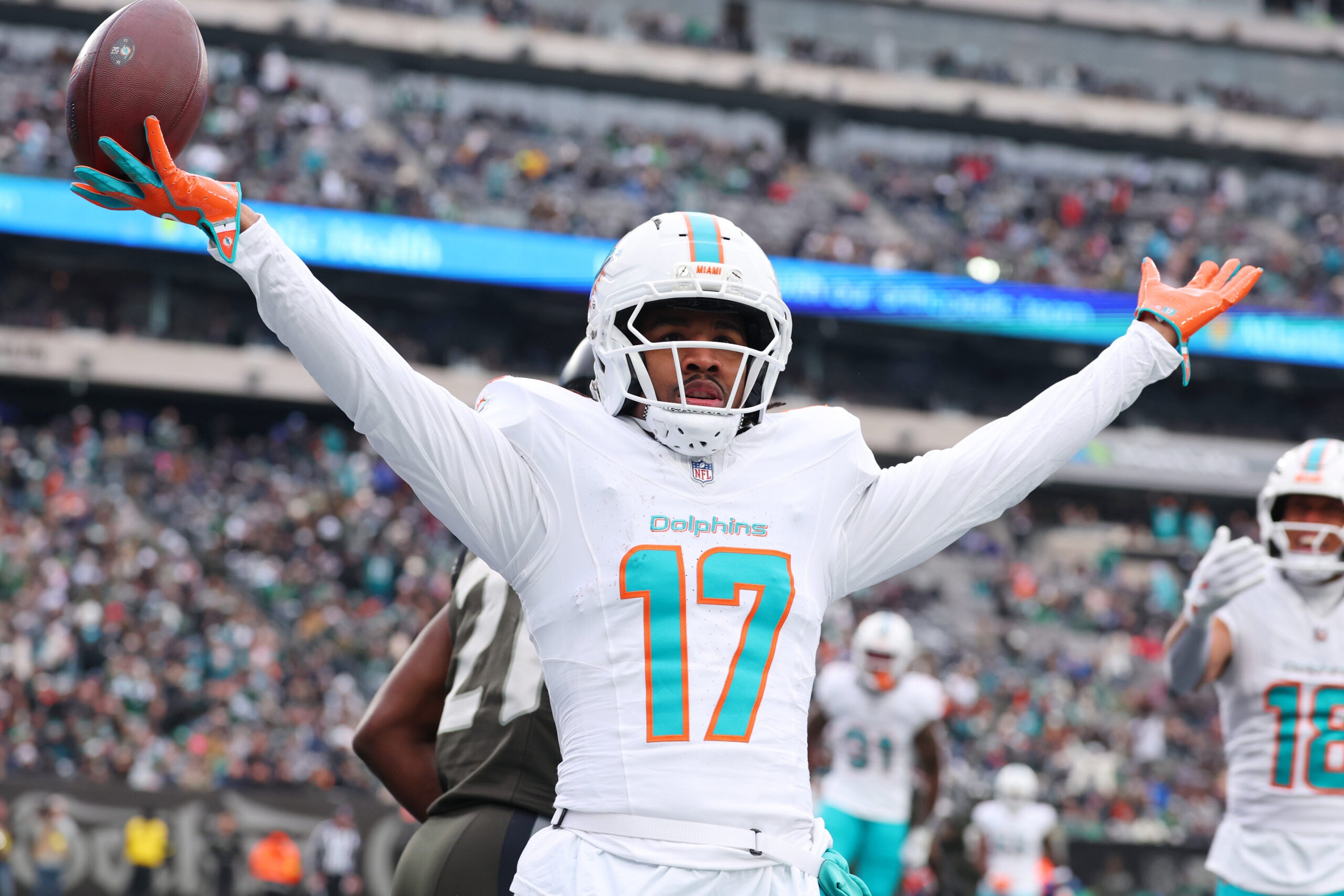 Dec 7, 2025; East Rutherford, New Jersey, USA; Miami Dolphins wide receiver Jaylen Waddle (17) reacts after making a catch for a touchdown against the New York Jets during the first half at MetLife Stadium.