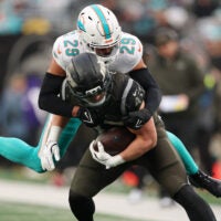 Dec 7, 2025; East Rutherford, New Jersey, USA; Miami Dolphins safety Minkah Fitzpatrick (29) tackles New York Jets fullback Andrew Beck (47) during the second half at MetLife Stadium.