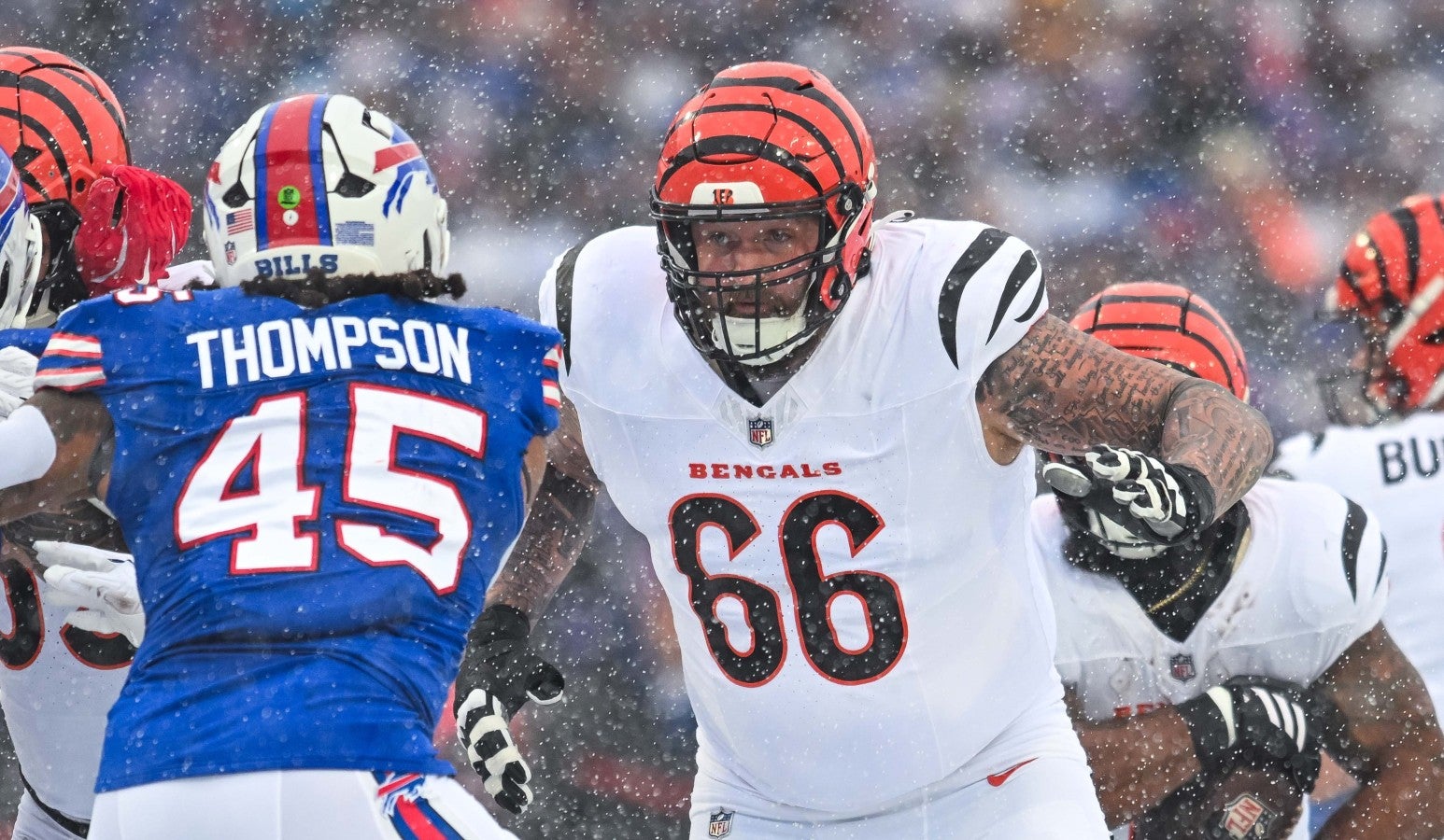 Dec 7, 2025; Orchard Park, New York, USA; Cincinnati Bengals guard Dalton Risner (66) looks to block Buffalo Bills linebacker Shaq Thompson (45) in the first quarter at Highmark Stadium.