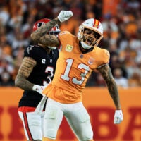 Dec 11, 2025; Tampa, Florida, USA; Tampa Bay Buccaneers wide receiver Mike Evans (13) reacts after catching a pass against Atlanta Falcons safety Jessie Bates III (3) (obscured) during the third quarter at Raymond James Stadium.