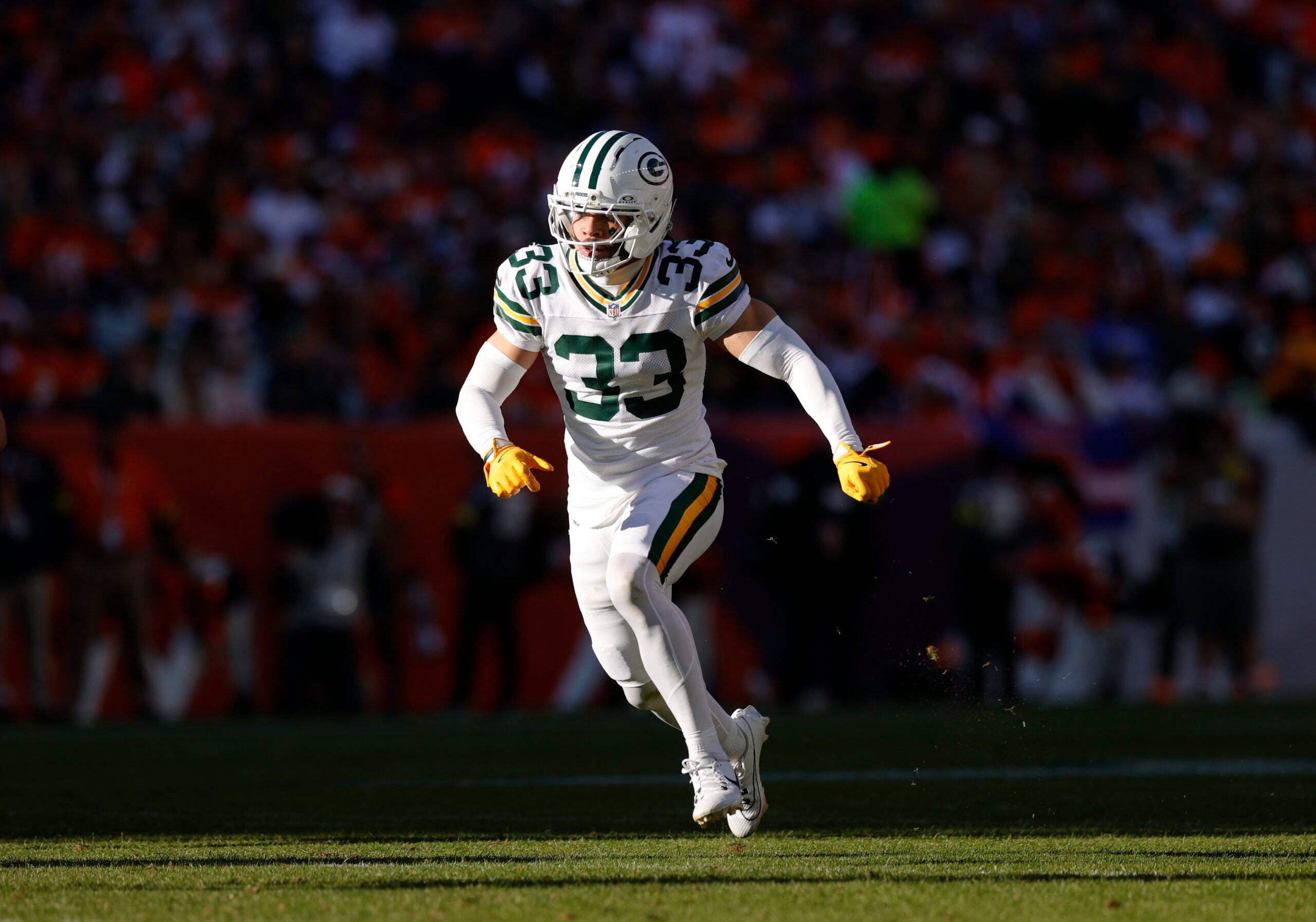 Dec 14, 2025; Denver, Colorado, USA; Green Bay Packers safety Evan Williams (33) runs downfield during the second quarter against the Denver Broncos at Empower Field at Mile High.