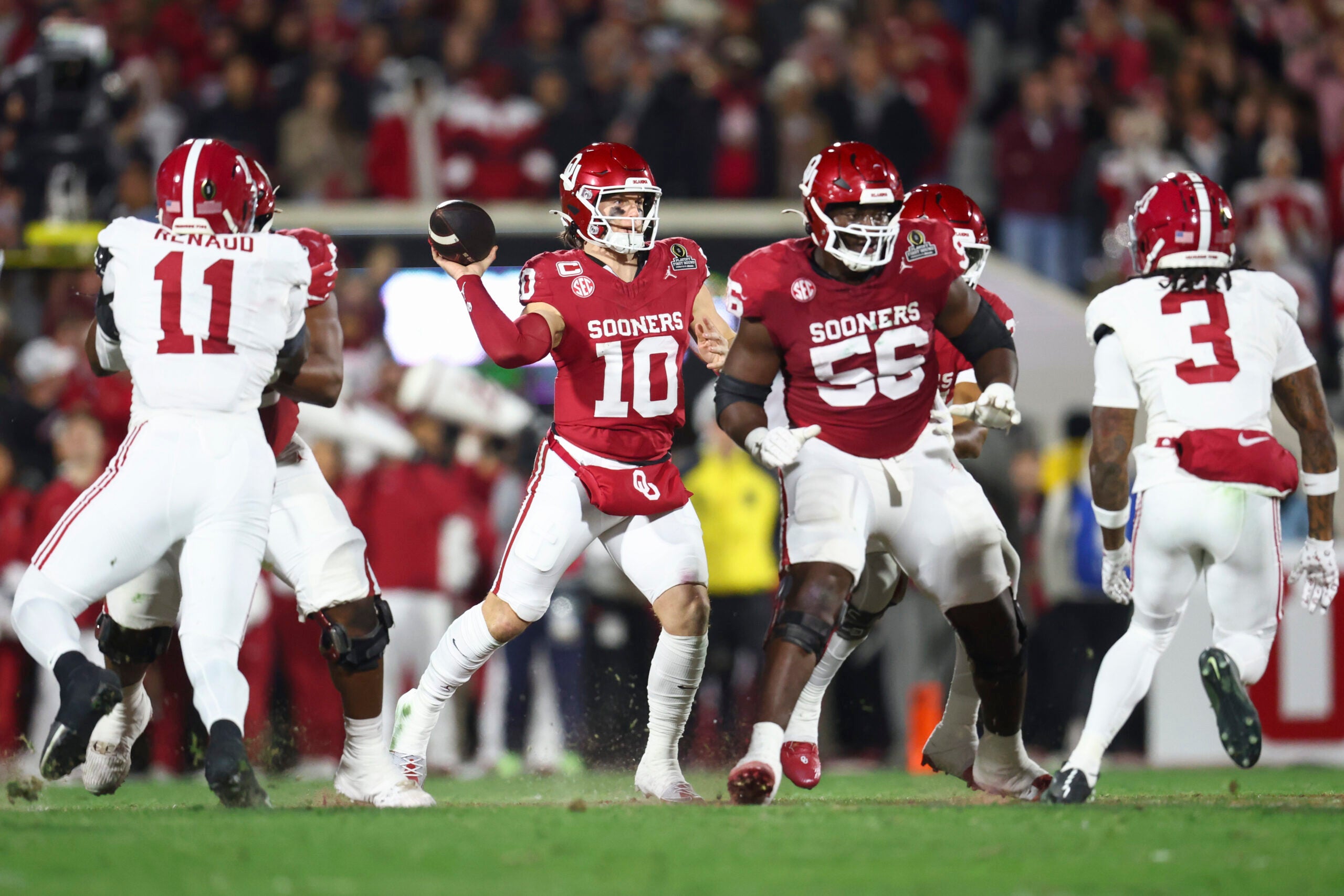 Dec 19, 2025; Norman, OK, USA; Oklahoma Sooners quarterback John Mateer (10) looks to make a pass in the first half against the Alabama Crimson Tide at Gaylord Family OK Memorial Stadium.