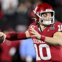 Dec 19, 2025; Norman, OK, USA; Oklahoma Sooners quarterback John Mateer (10) looks to make a pass in the second half against the Alabama Crimson Tide at Gaylord Family OK Memorial Stadium.